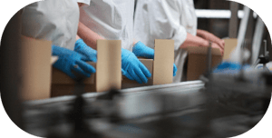 People’s hands working on kit assembly