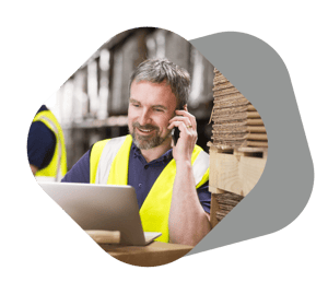 Warehouse staff in yellow safety vest